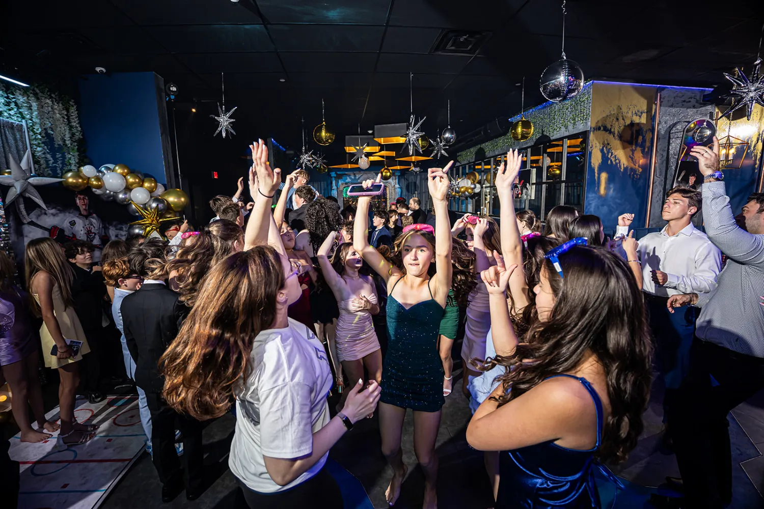 Guest lifted on a chair during the hora at The Place Restaurant